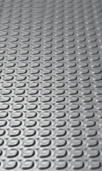 patterned polyethylene surface, invoking a sense of movement, densely packed, photorealistic, featuring shallow depth focusing on grooves, highly detailed, occasional sparkles and reflections, 8K rendering, opaque and solid, low-level commercial lighting, shot with a standard kit lens.